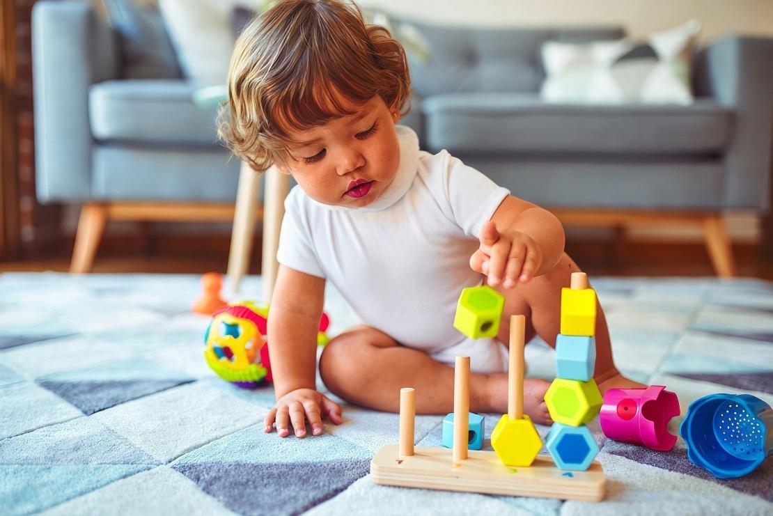 Baby playing with toy blocks