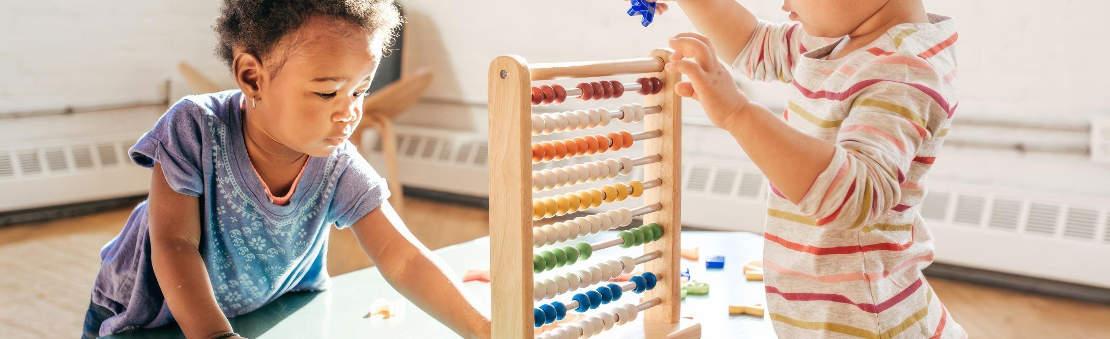 Children playing with an abacus