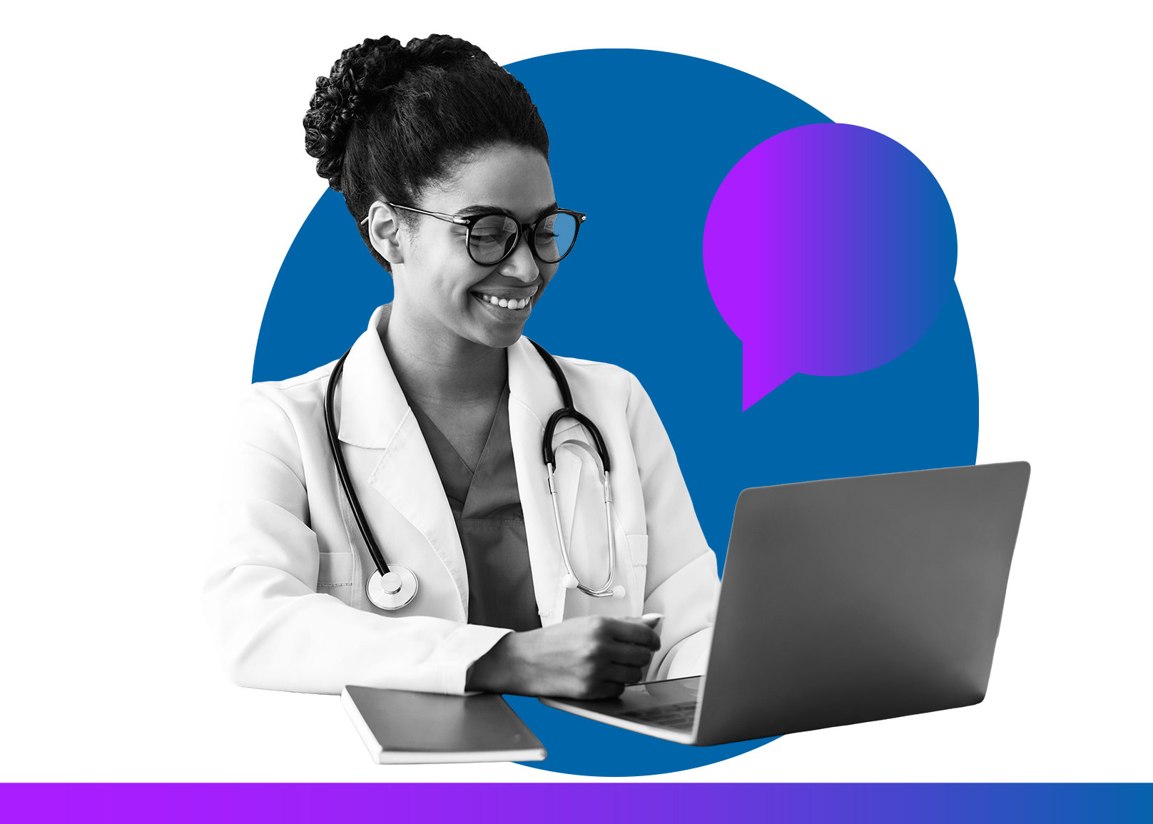 Smiling clinician wearing a white coat and stethoscope while working on a laptop