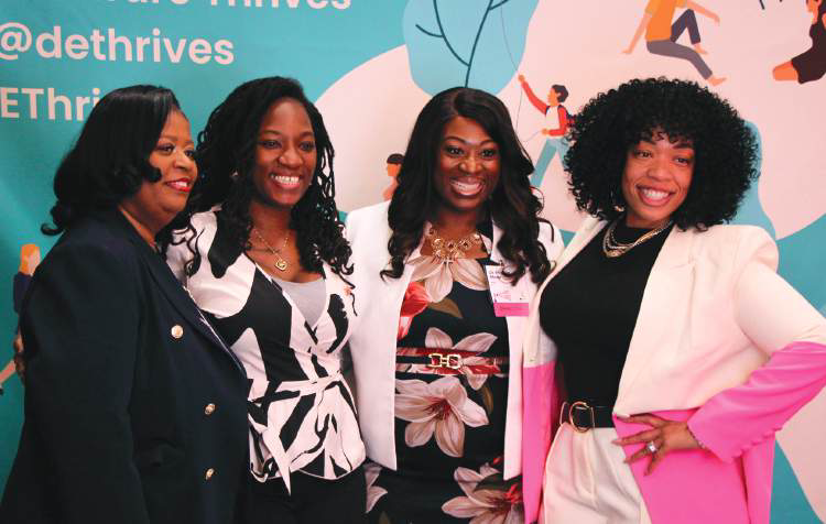 Leaders at the DEThrives photo wall