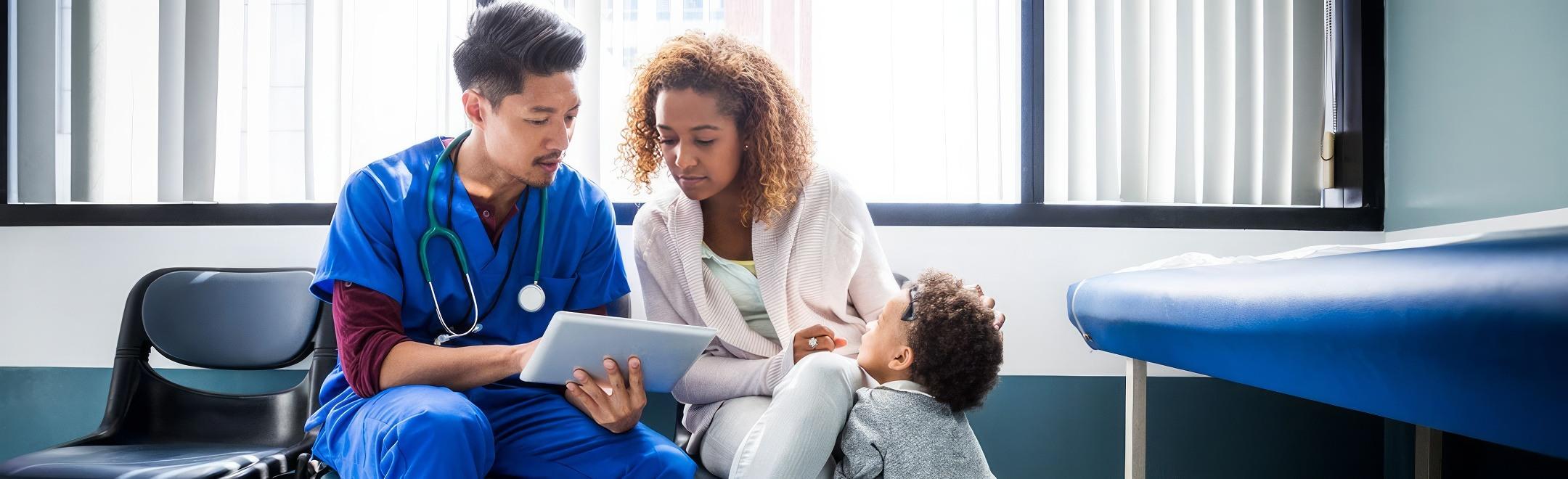 Mother with baby talking to doctor