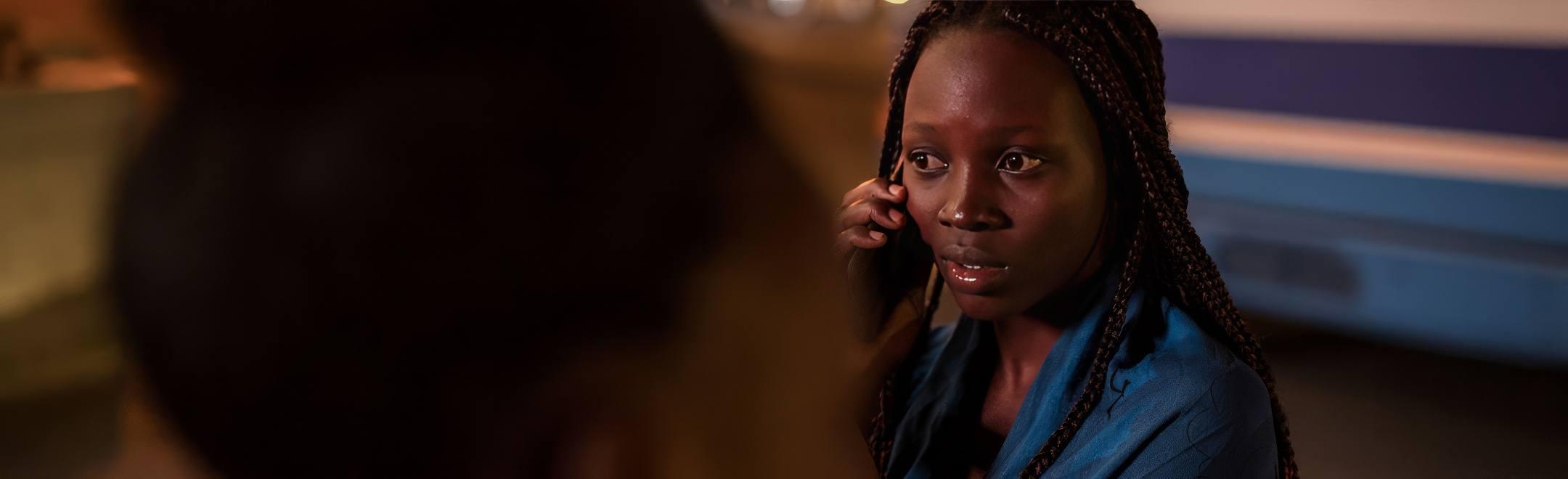 A pregnant teen getting help on the phone.