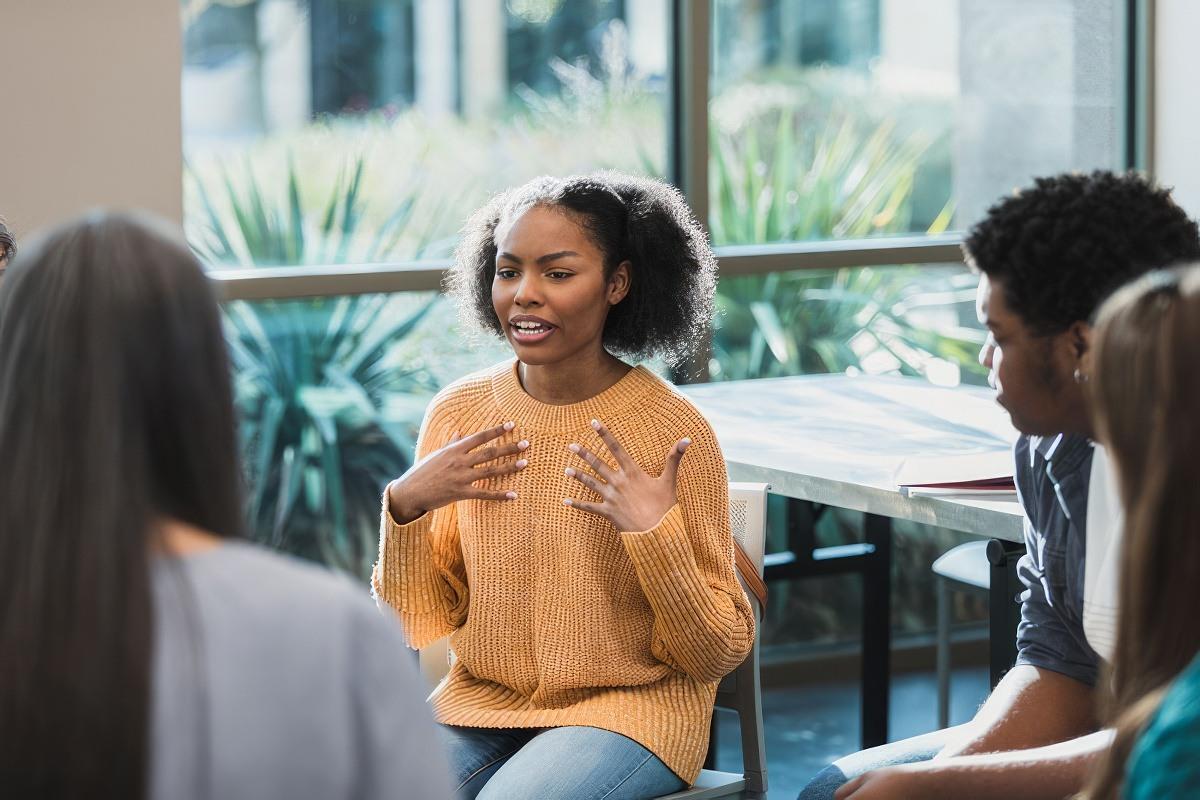 Teens in a group talking about their emotional health